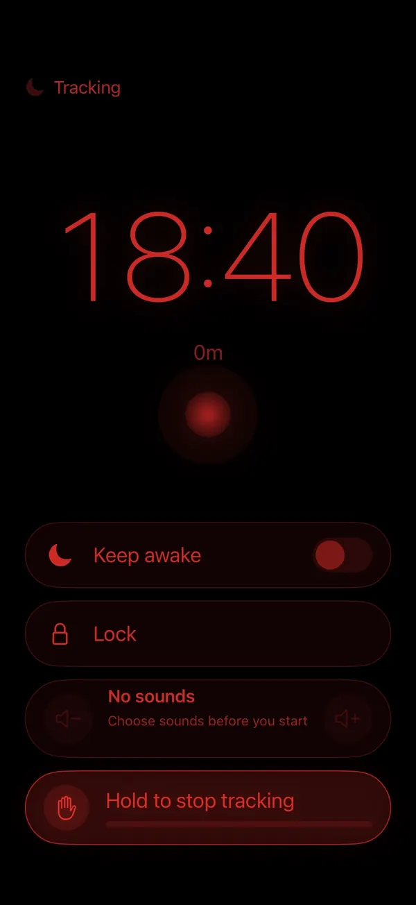SleepLog bedside clock: dim red time on black with keep awake, lock and hold to stop tracking